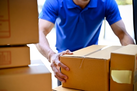 Delivery industry represented by man holding boxes