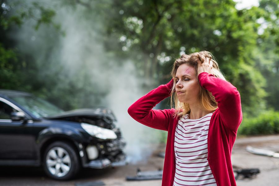 woman looking distressed after a car crash in San Jose